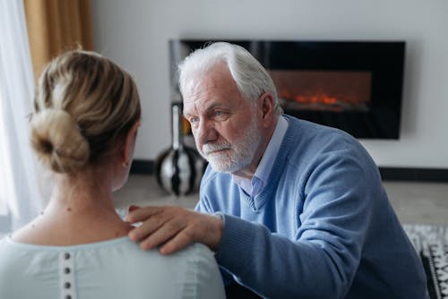 Free Elderly Man Comforting a Woman Stock Photo